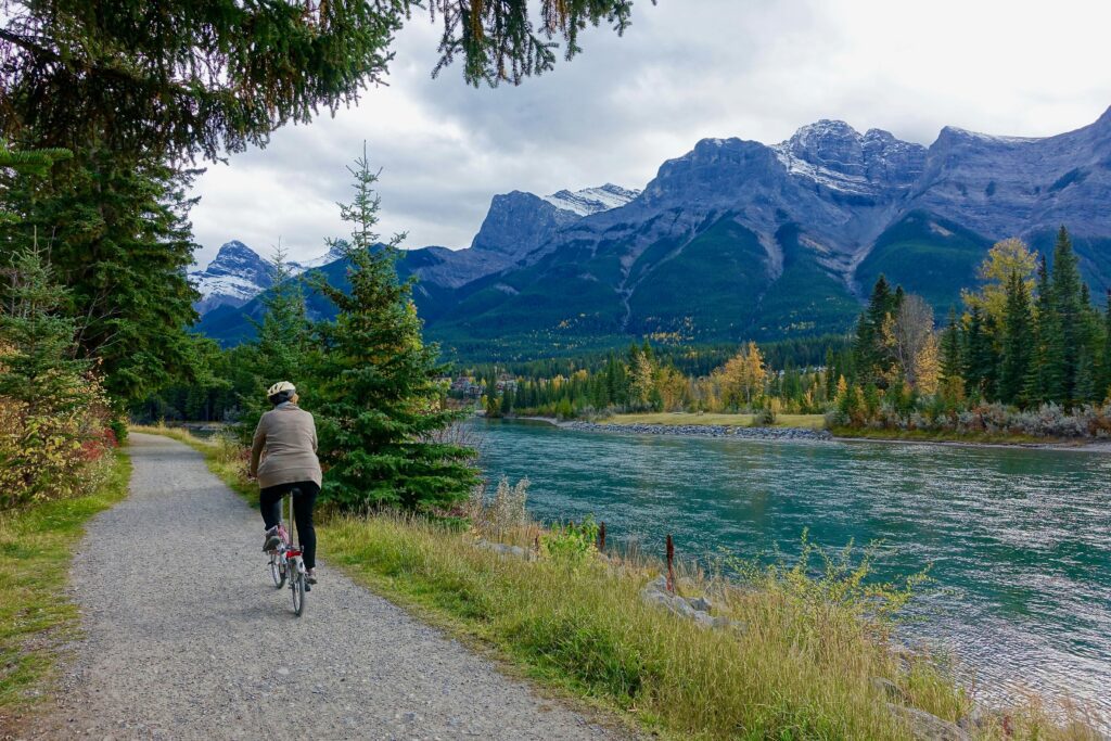 bicycle ride next to stream and mountains